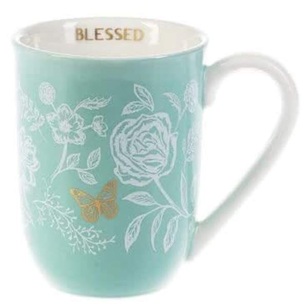 Mint blue ceramic mug with white floral design, gold butterfly, and 'Blessed' printed inside the rim