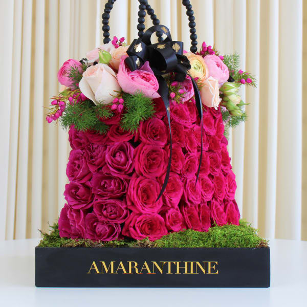 Rose and Ranunculus Purse Arrangement
