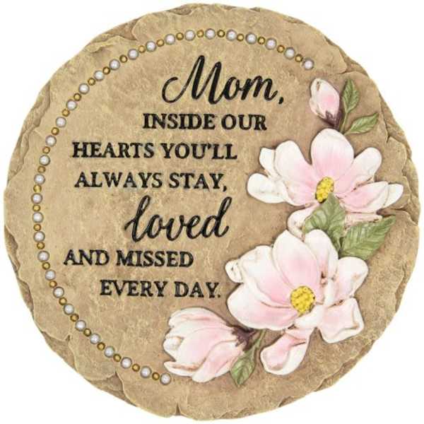 Round memorial plaque with pink flowers and a mother tribute message