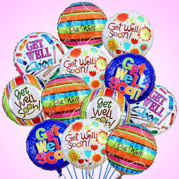 Cluster of colorful get well soon balloons on a pink background