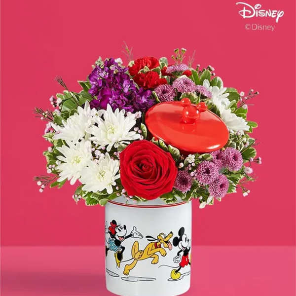 Bouquet of mixed flowers in a Disney character tin container