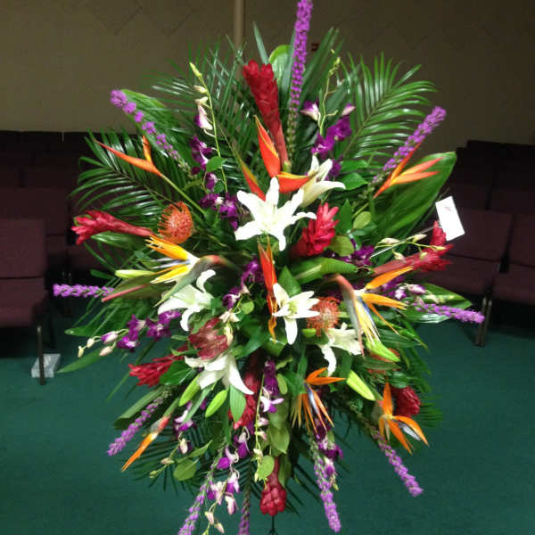 Large tropical floral spray with white lilies and purple accents