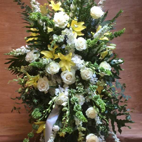 Tall white and yellow floral spray with roses and lilies