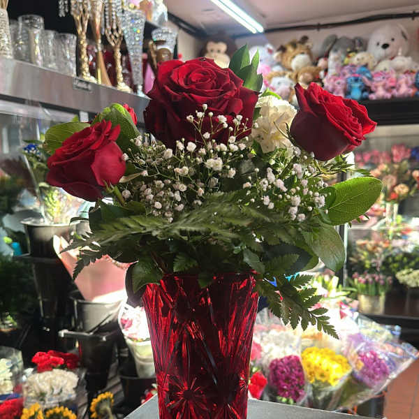 1/2 Dozen Roses in a see-through red vase
