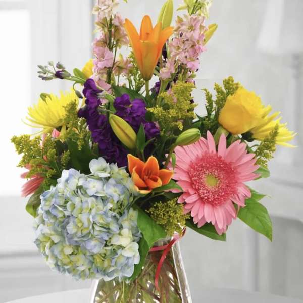 Colorful mixed bouquet in a clear glass vase