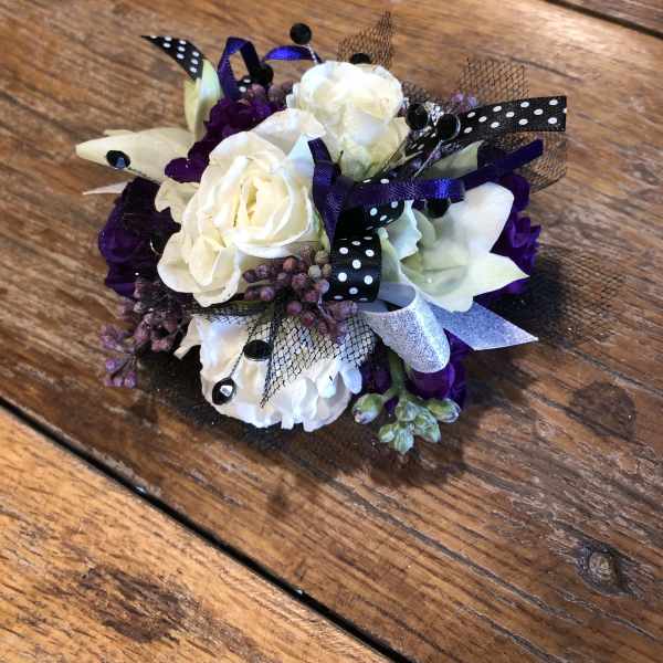 White, black, blue, lavender prom wrist corsage.