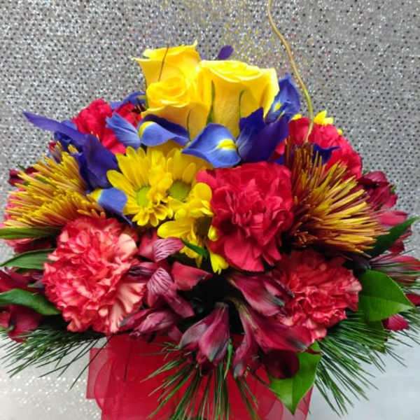 Colorful bouquet of mixed flowers in a glass vase