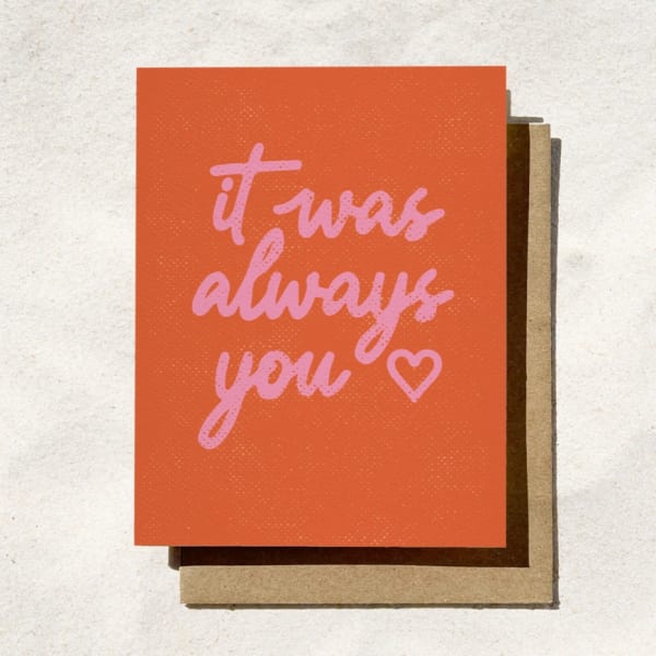 Orange greeting card with pink text reading "it was always you" and a heart