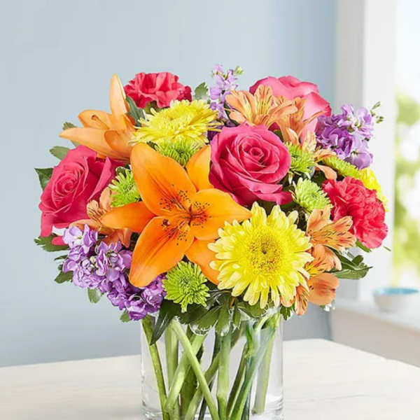 Colorful mixed bouquet in a clear glass vase