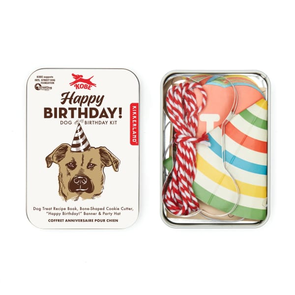 Dog birthday kit in a metal tin with a party hat and cookie cutter