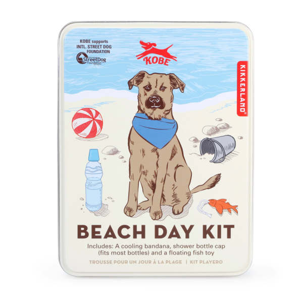Beach day kit tin with a dog illustration and accessories
