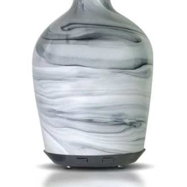 Marble-patterned glass essential oil diffuser with a narrow neck and dark base