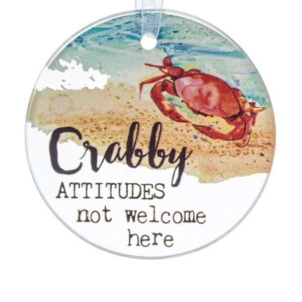 Round beach-themed hanging ornament with a red crab and playful text.