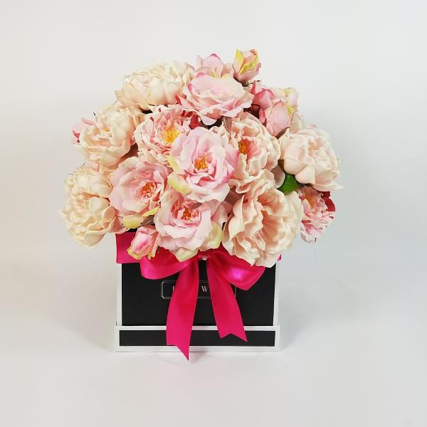Pink and cream rose bouquet in a black gift box with a bright ribbon
