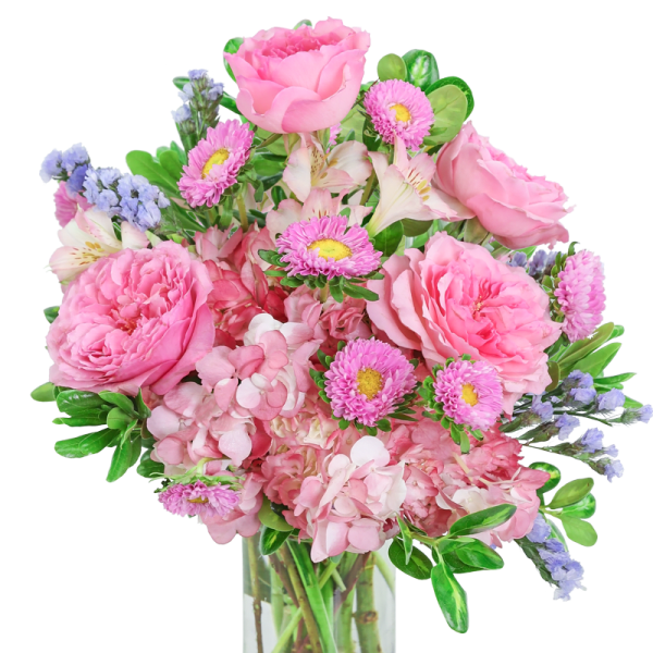 Pink mixed flower arrangement with roses, hydrangeas, and asters in a clear glass cylinder vase