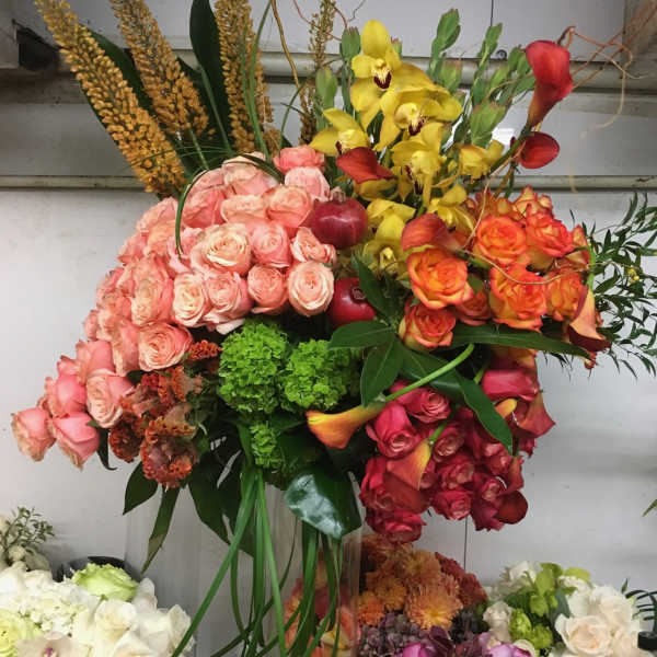 Large mixed bouquet with roses, orchids, and calla lilies