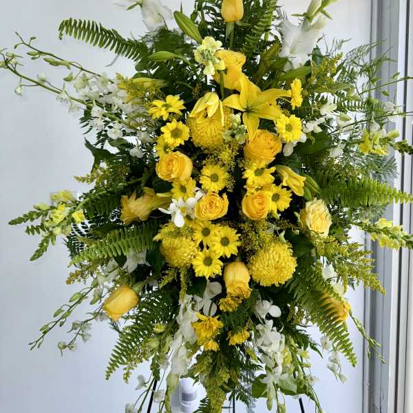 True sympathy yellow Spray by Joly’s Florist