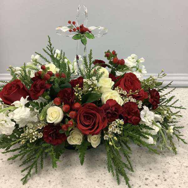 Red and white rose arrangement with a crystal cross topper