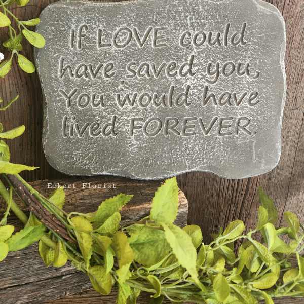 Gray memorial stone with an engraved sympathy quote