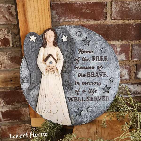 Angel memorial plaque with stars and engraved tribute text