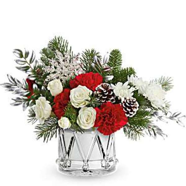 Red and white floral arrangement in a clear glass vase