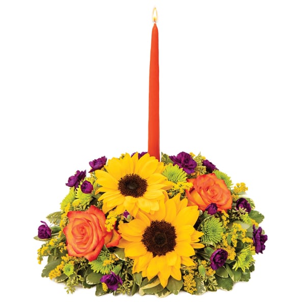 Sunflower and rose centerpiece with a tall orange candle
