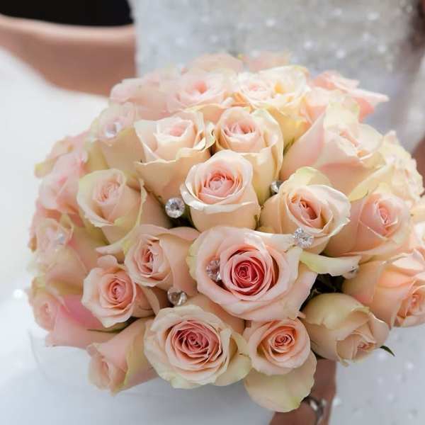 Bouquet of pale pink roses with jeweled accents