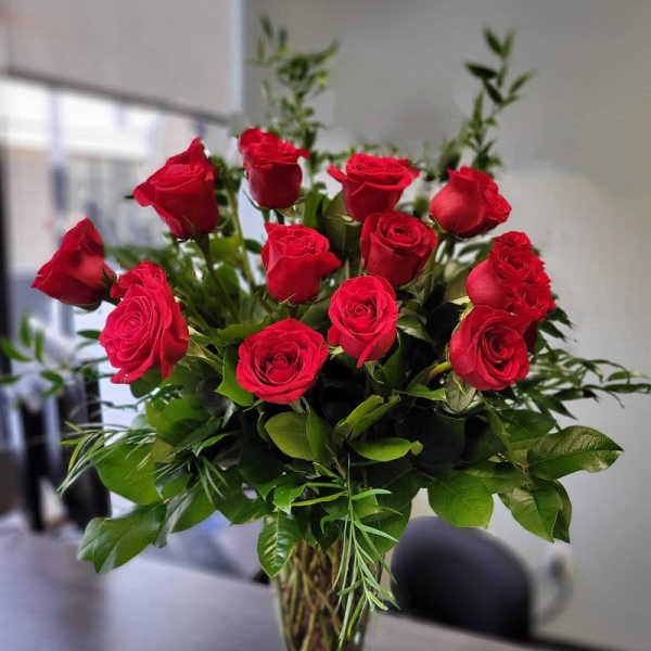 Premium dozen red roses in the vase