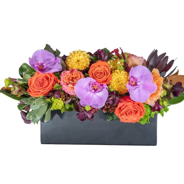 Mixed bouquet of orange roses and purple orchids in a black rectangular container