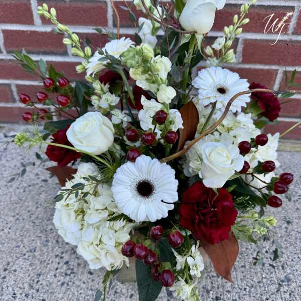 Bouquet of white roses, white gerbera daisies, and red carnations