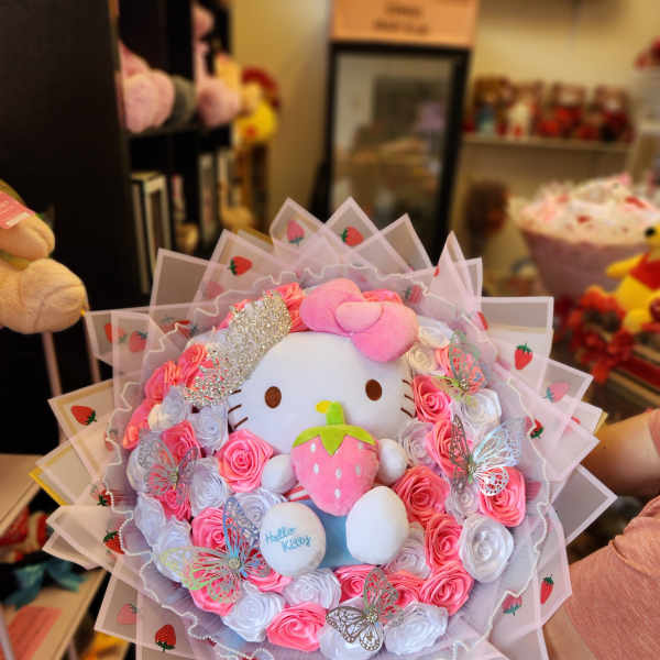Hello Kitty plush bouquet with pink and white roses and strawberry wrap