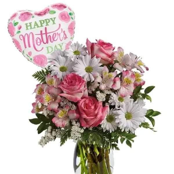 Pink and white bouquet with roses and daisies in a glass vase and a Happy Mother's Day balloon.