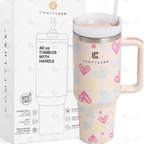 Pink heart-pattern 40 oz tumbler with handle beside branded box