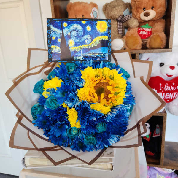 Blue and yellow flower bouquet with a small Starry Night card