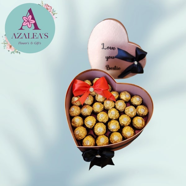 Heart-shaped gift boxes filled with gold-wrapped chocolates