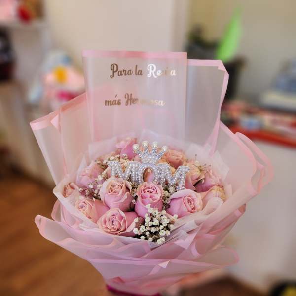 Pink rose bouquet with a jeweled MOM topper and pink wrap