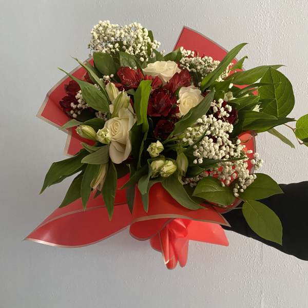 Hand arrangement of mixed flowers in your choice of color