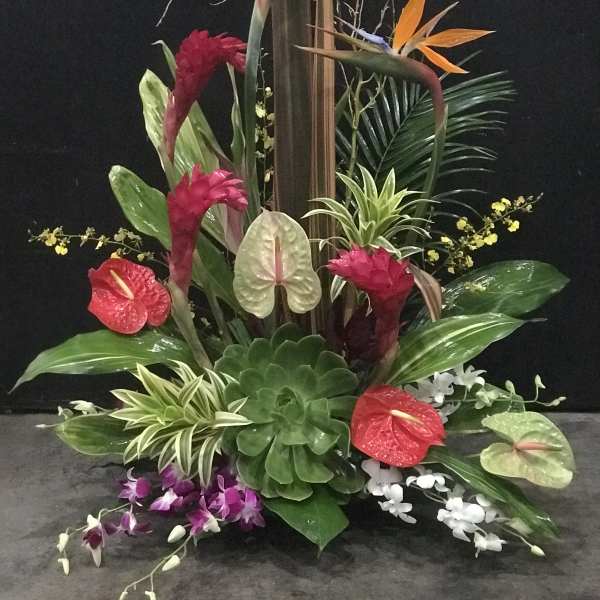 Tropical floral arrangement with birds of paradise and anthuriums