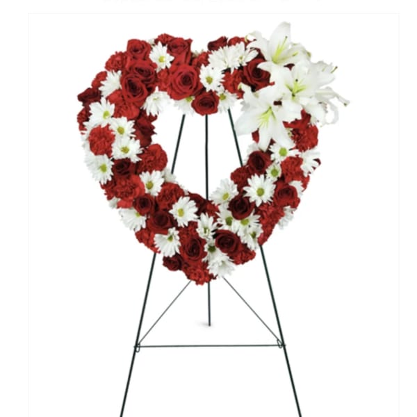 Heart-shaped standing floral wreath with red roses and white daisies