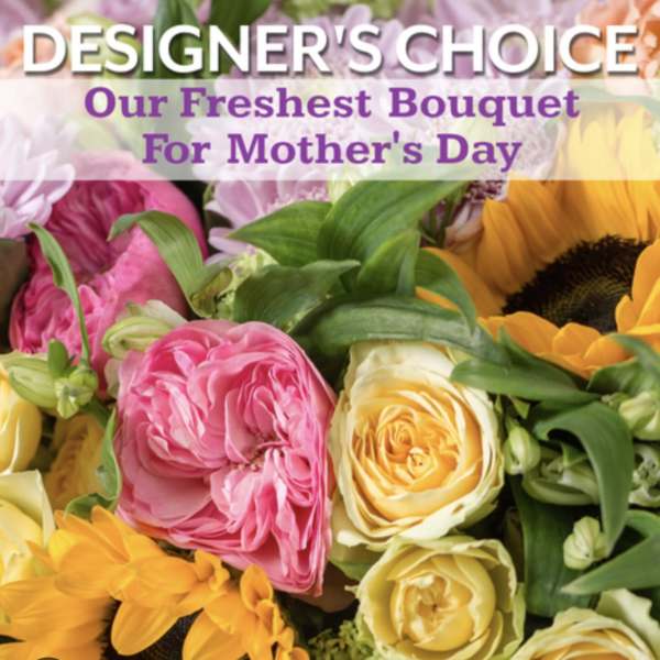 Close-up of a mixed bouquet with yellow roses, pink blooms, and bright sunflowers for Mother's Day