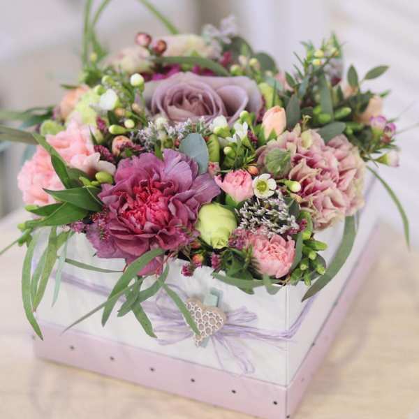 Mixed pink and lavender bouquet in a white gift box