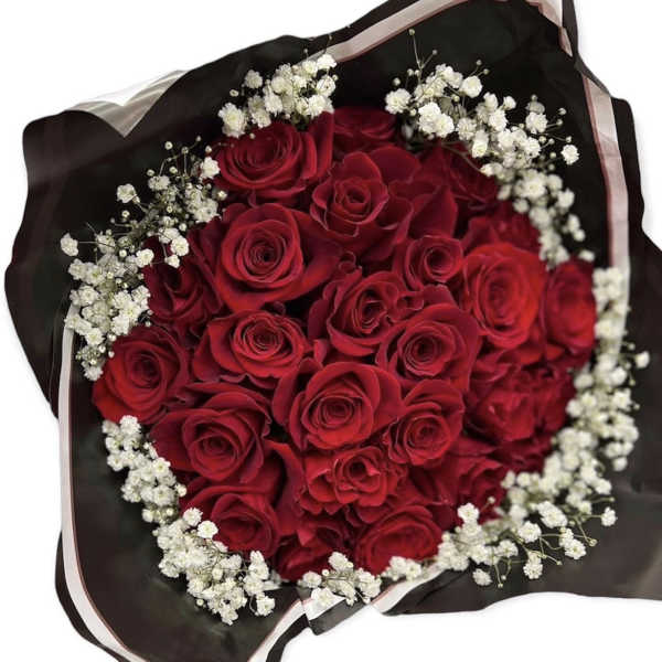 Bouquet of red roses with white baby's breath in black wrapping