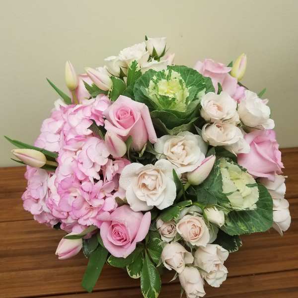 Pink and white rose bouquet with hydrangeas and tulip buds