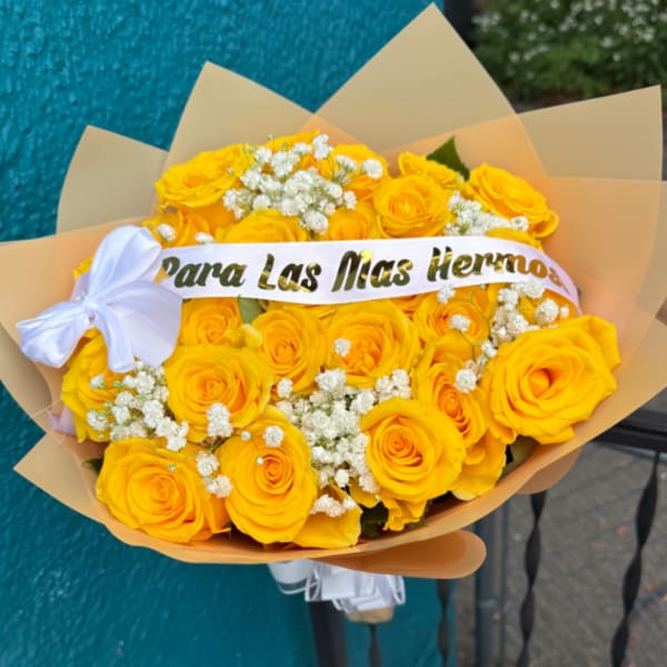 Yellow rose bouquet with white baby's breath and a white ribbon