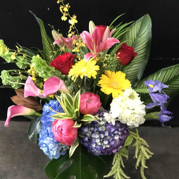 Colorful bouquet with lilies, roses, hydrangeas, and gerbera daisies
