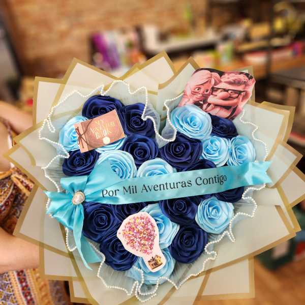 Bouquet of blue roses with a turquoise ribbon and small decorative cards