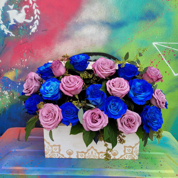 Box arrangement of pink and blue roses