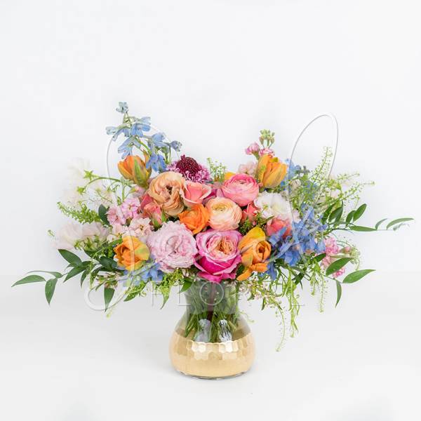 Colorful mixed bouquet in a clear glass vase