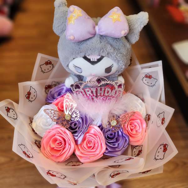 Plush Hello Kitty bouquet with pink and purple roses and a birthday topper