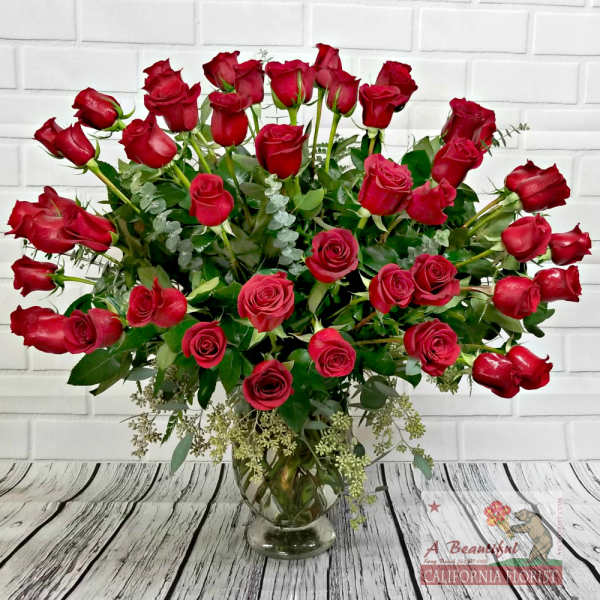 50 Fifty RED Roses in a vase from ABC Florist